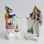 A pair of Staffordshire Crimean war figures of a soldier’s wife leaning on a gravestone, and a