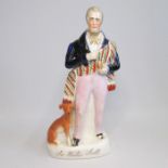 A Staffordshire figure titled Walter Scott Circa: 1840 Size: 28cm H Condition: The dog’s head