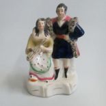 A Staffordshire figure of a gentleman standing by a seated lady with a violin. Pugh E figure 110