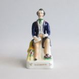 A Staffordshire Alpha factory figure of Cobden sitting. Pugh B figure 46 Circa: 1847 Size: 19.5cm