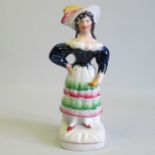 A Staffordshire theatrical figure of a lady Circa: 1845 Size: 21cm H Condition: In good condition