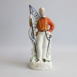 A Staffordshire figure of Giuseppe Garibaldi holding a flag with ‘Liberte’ Pugh C figure 284