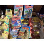 Diecast: A collection of assorted diecast vehicles to include carded Thunderbirds, Simpsons,