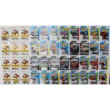 Hot Wheels: A collection of approximately 80 Hot Wheels long card vehicles to include: Flying