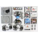 PlayStation: A pair of unboxed PlayStation consoles, with four controllers, four memory cards, and