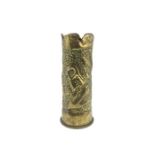 A piece of WWI German trench art, a German shell, with indented design with the word Ypern and a