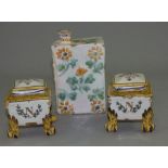 A pair of 19th C French faience footed pots and covers 8.5cm high with a French Faience bottle in