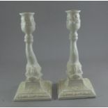 Pair of white glazed Italian candlesticks , modelled with dolphins 23cm high (2) good condition