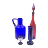 A collection of coloured glassware, comprising:- a large 19th red decanter with stopper 40cm H (