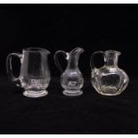 A group of three cut glass jugs of varying sizes (3)