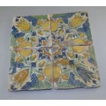4 18th C spanish tiles , decorated with hand painted flowers each 14cm in diameter (4) Condition