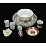 A collection of porcelain by various makers including:- two Royal Worcester Evesham pattern flan