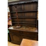 A mid 20th Century dresser with later plate rack along with a very small torchere on turned column