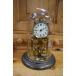 German-made brass mantle clock in glass dome