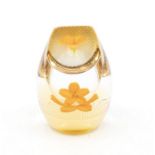 Caithness Floral Gems paperweight with single orange flower in a double faceted paperweight.