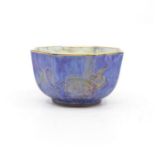 A Wedgwood lustre bowl of octagonal form gold dragons on purple ground to the exterior and dragons