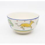 A Susie Cooper Nursery Ware bowl featuring animal and tree designs to the exterior. Diameter