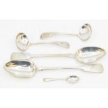 A collection of silver flatware to include: a pair of Victorian fiddle pattern serving spoons,
