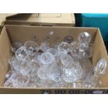 A good quantity of crystal including glasses sets, three nicely cut decanters, including a ships