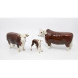 Three Beswick figures of a bull, cow and calf no chips or cracks