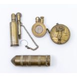 Four WWI trench art lighters, one of which has a WWI soldier looking through a keyhole at a French