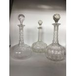 Three clear glass onion shape decanters, to include one Edwardian with faceted neck, geometric