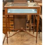 Edwardian collectors cabinet, on spear legs, bevelled glass top and sides, inlaid with pale blue