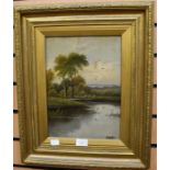 A pair of oils on board, signed E Horton, lake/river scenes, each 33 x 24cm, in gilt frames