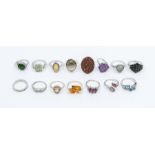 A collection of fifteen Gems TV silver and gemstone rings to include a diamond cross over, size L,