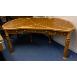 A 20th century walnut and satinwood crossbanded desk, shaped rectangular top with satinwood