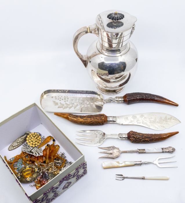 A Victorian style silver plated jug and cover, the spout with gargoyle terminal, the cover with
