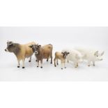 Five John Beswick figures of a bull, cow and calf with two pigs no chips or cracks