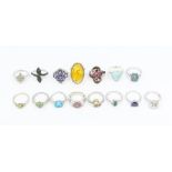 A collection of fifteen Gems TV silver and gemstone rings to include a sphene and white zircon ring,