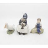 Three Copenhagen figures of a boy and girl sewing and goose slight chip on goose tail feathers