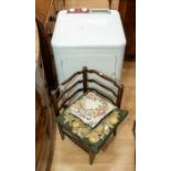 A vintage washing machine and a small child's corner chair