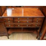 A mid 20th Century cutlery cabinet having 6 small drawers, a retractable integral tray and a lower