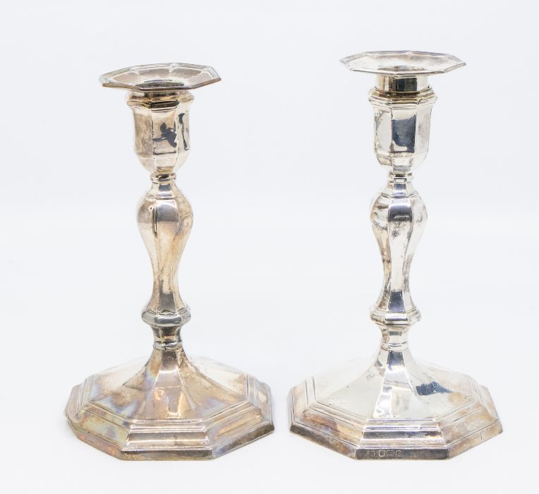 A pair of George II STYLE silver octagonal candlesticks with detachable drip pans, hallmarked by