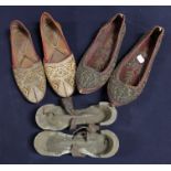 Three pairs of Indian and Far Eastern shoes; A pair of worn painted clogs (late Victorian) A pair of