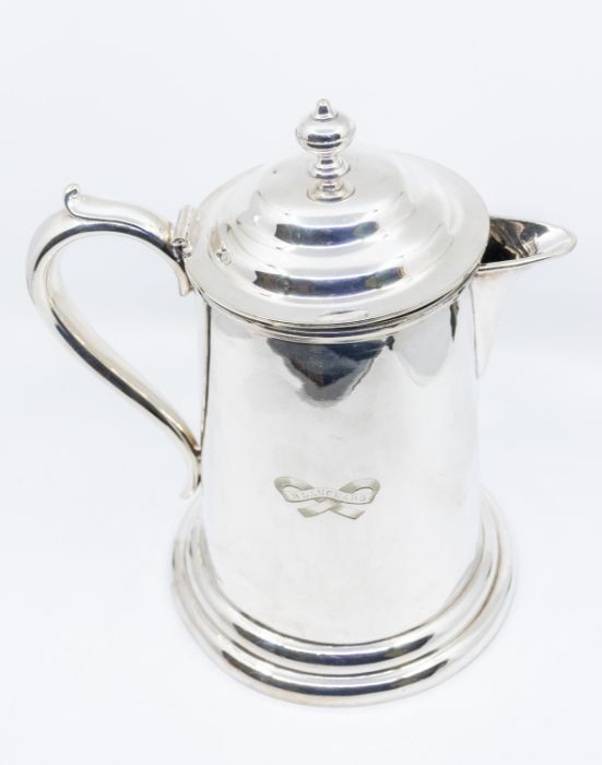 A large Victorian style silver plated flagon and cover, the plain body engraved: BLANCHARD within