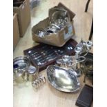Collection of silver plated wares including tray, fruit baskets, candlesticks, spoons, flat wares,