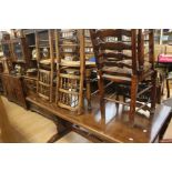 Oak Refectory Table along with six oak spindle backed reeded chairs