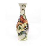 A 2007 Moorcroft vase, with cream ground, square top and foliage detail