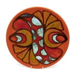 Poole Pottery: A Poole Pottery Delphis charger on red ground, shape mark 5. Diameter approx 35cm.