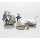 Four Copenhagen porcelain figures, and a small bird figure (AF)