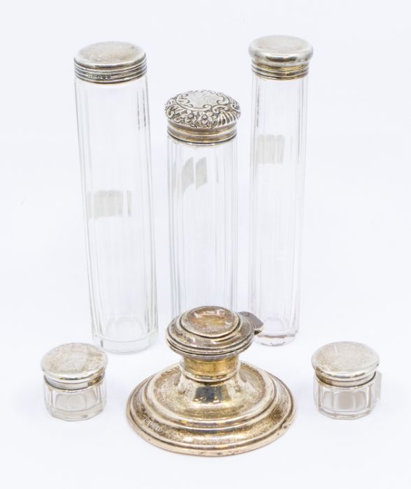 A group of silver to include: five various silver topped facet cut toilet bottles, all hallmarked