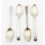 A set of four George III Hanoverian table spoons, each engraved with a crest, hallmarked by Paul