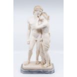 A Roman figure of a man and woman on a marble stand