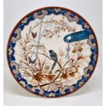 A late 19th Century hand painted charger with foliage and parrot detail