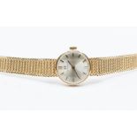 A ladies 9ct gold Omega wristwatch, circa 1960's, comprising a round champagne dial, applied gold