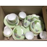 An Ansley 10 piece tea service in a country meadow scene